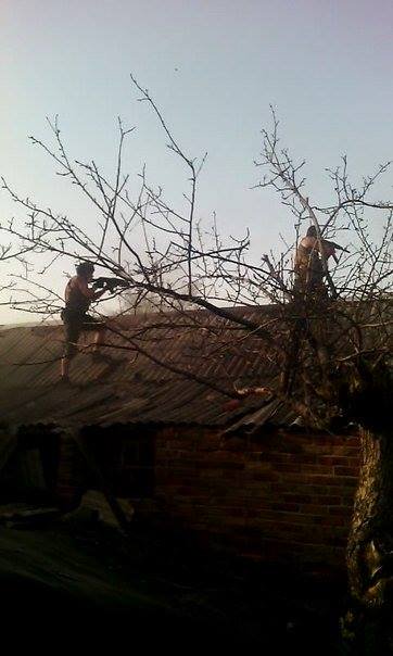 Russian militants firing from the roofs of private houses