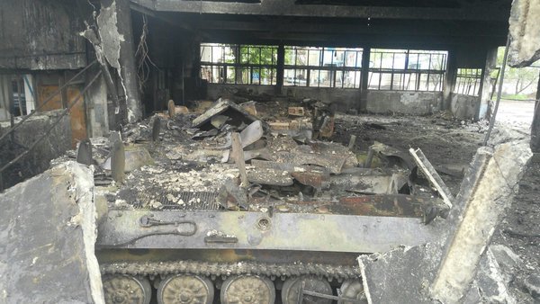 Destroyed vehicles after shelling of Maryinka in April
