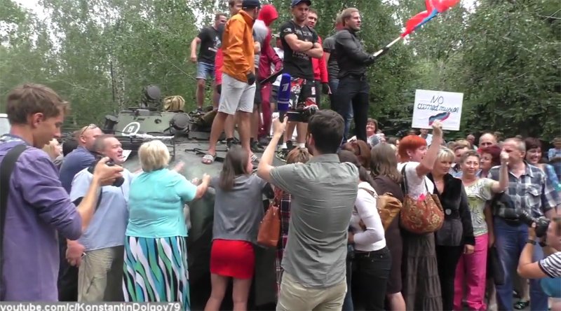 Shakhtarsk. Banners read no to armed mission. Protest drill