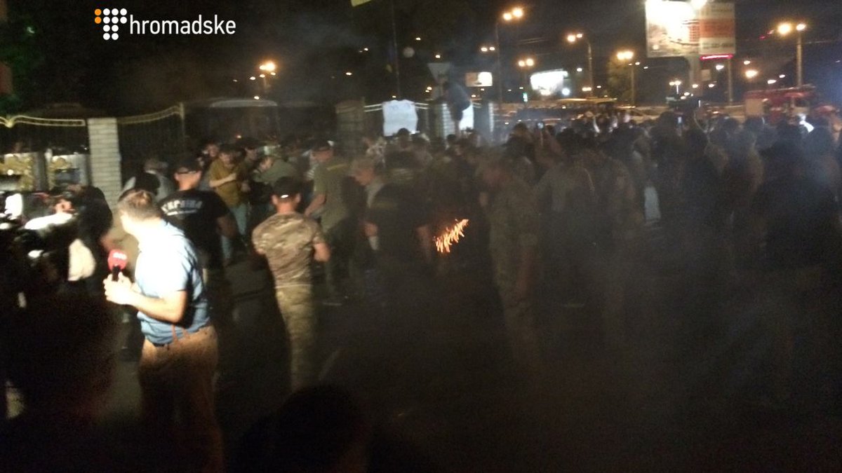 Clashes at a Kyiv court between police  and  supporters of volunteer paramilitaries put on trial for kidnapping, torture  