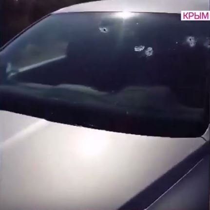 Dojd TV video on civilians car that was shot by Unknown people in masks in Crimea