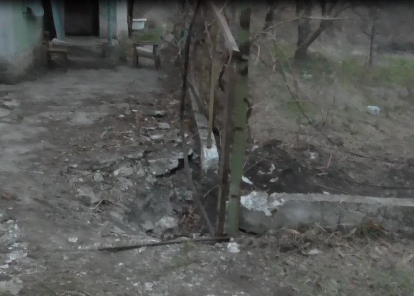 Craters from recent shelling in a village near Mariupol on the front line in SE Ukraine  
