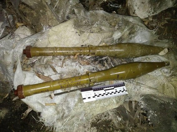 Ukrainian civilian finds a MON-50 anti-personnel landmine, 3 grenades, and 2 RPG rounds in a forested area in Donetsk    