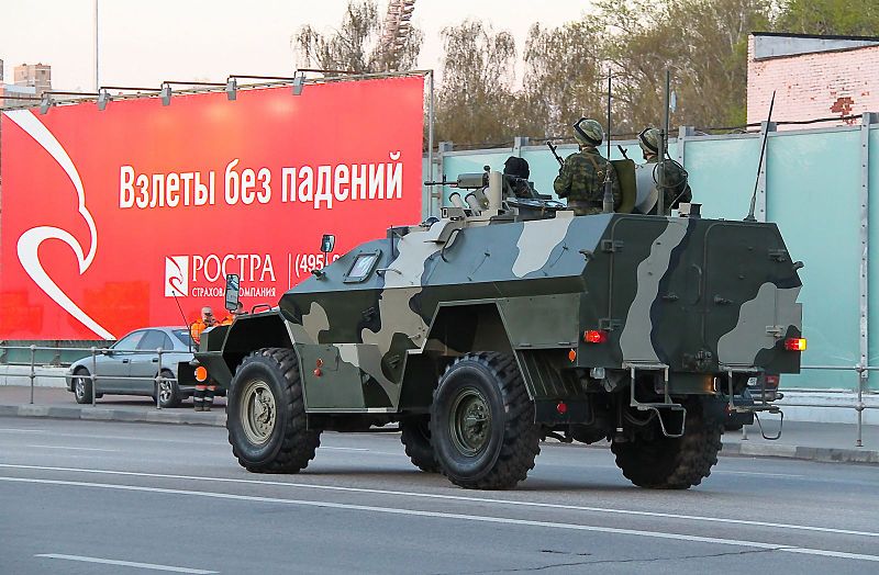 CIT geolocation: Kremlin-linked Wagner PMC KamAZ-43269 convoy driving from Molodhvardiysk to Krasnodon (Sorokine) in Luhansk region, Eastern Ukraine in Winter 2015.  Note trolleybus wires over the road 