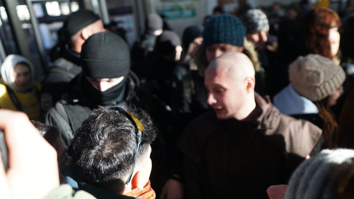 Marchers, thanks to the presence of the far right,have been forced down into the metro, being shouted at from beyond the cordon   