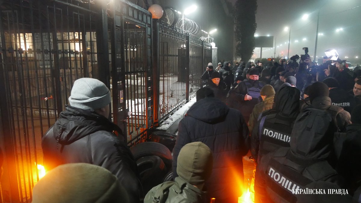 Near Russian Embassy protesters attempting to light the tires, police extinguishing 