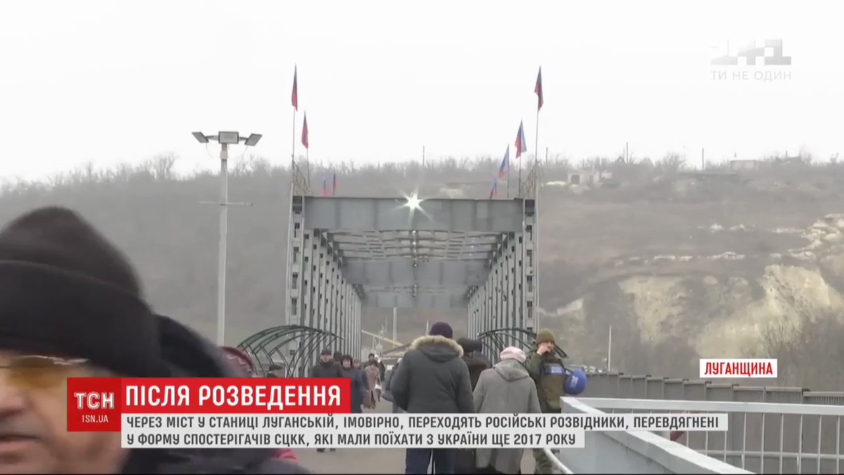 Bridge separating Ukrainian and Russian-controlled territory in Donbass seems to be guarded by two Russian soldiers wearing  JCCC insignia, who are reluctant to explain themselves. OSCE cannot say who is this also
