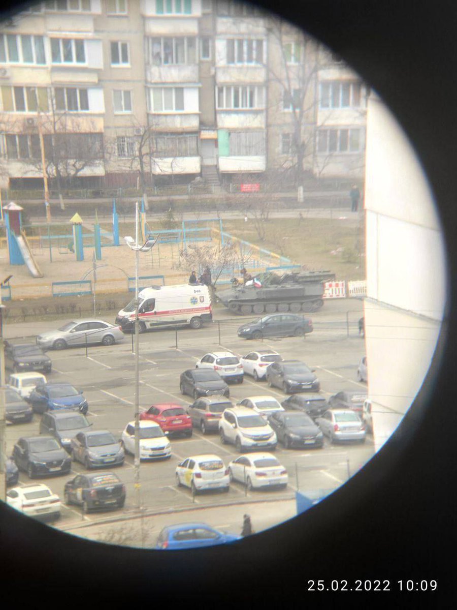 People blocking movement of Russian military vehicle near Drim Taun at Obolon in Kyiv