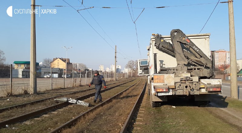 Rescuers working on the site of shelling of humanitarian aid delivery point in Kharkiv. Parts of Uragan missile with cluster ammunition recovered 