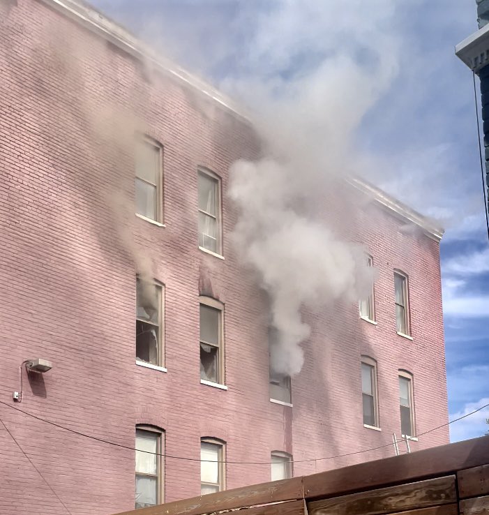 Fire unit block R St NW. Fire knocked down. Checking for extension to floor above & attic in 4 story apartment building. 1 adult female being evaluated by EMS. Investigators on scene. DC firefighters